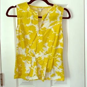 Yellow and white sleeveless peplum top